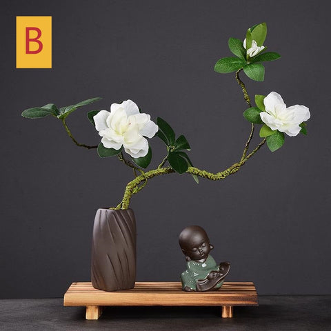 Pequeño monje con flor de Feng Shui