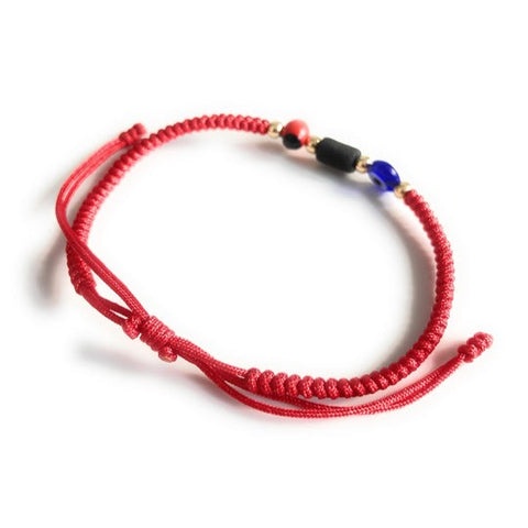 Pulsera poderosa de hilo rojo con semilla de peonía y azabache genuino