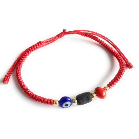 Pulsera poderosa de hilo rojo con semilla de peonía y azabache genuino